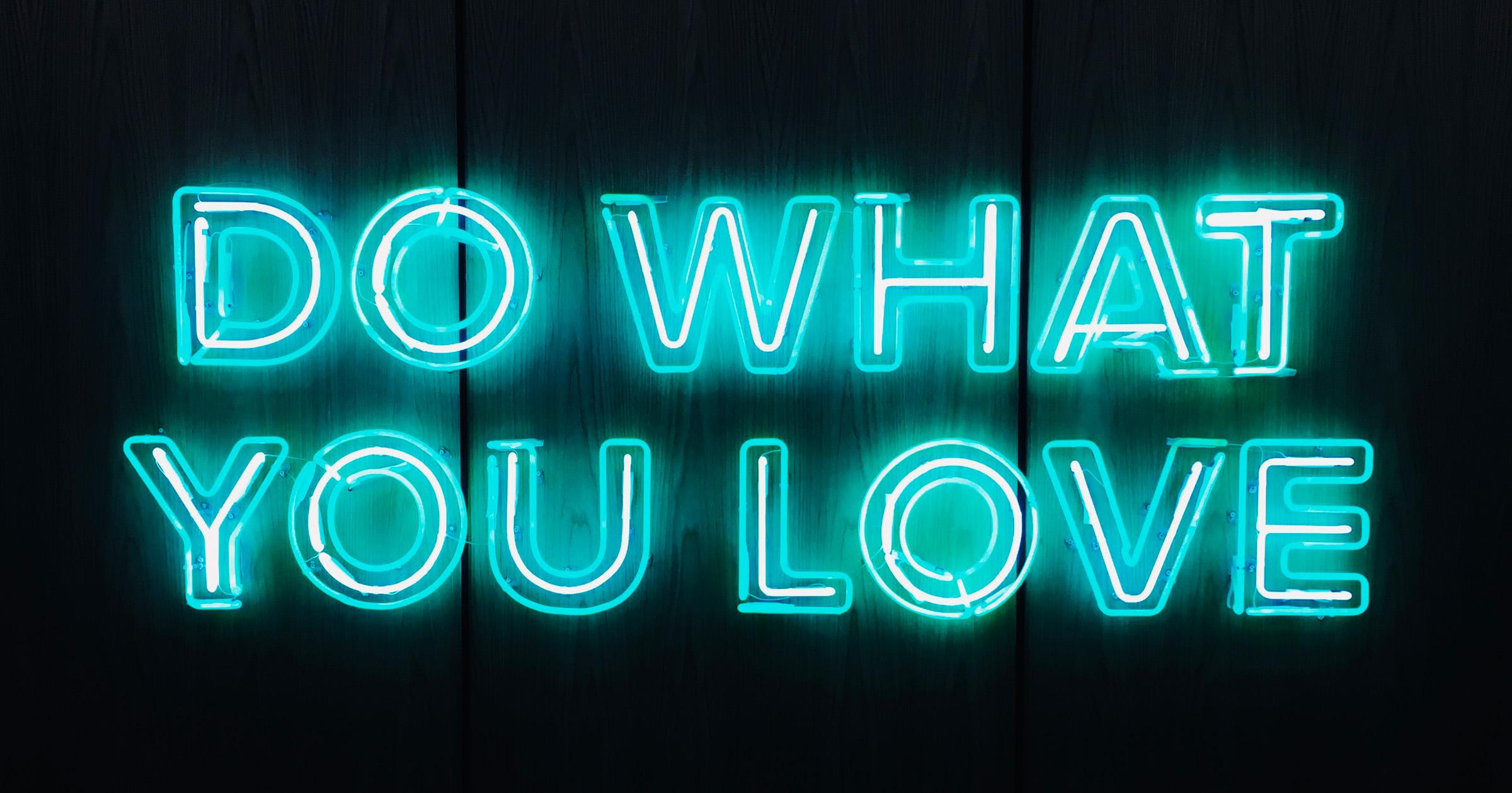 neon lights that spell out "do what you love"