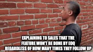 project management gif: talking to sales is like talking to a brick wall